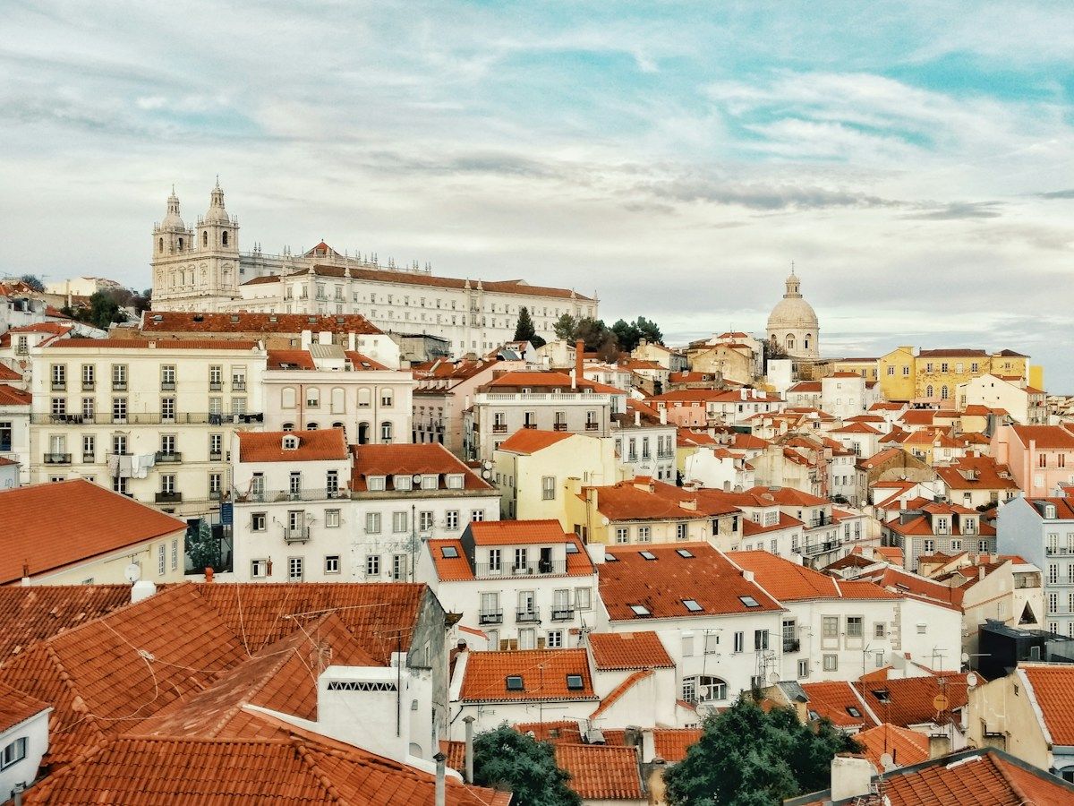 The rooftops and streets of Alfama, Lisbon, seen from above.