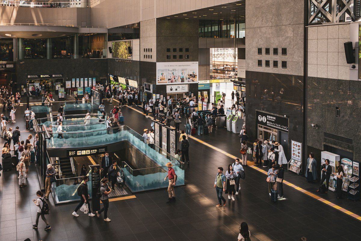 Passengers moving through the concourse at Kyoto Station.