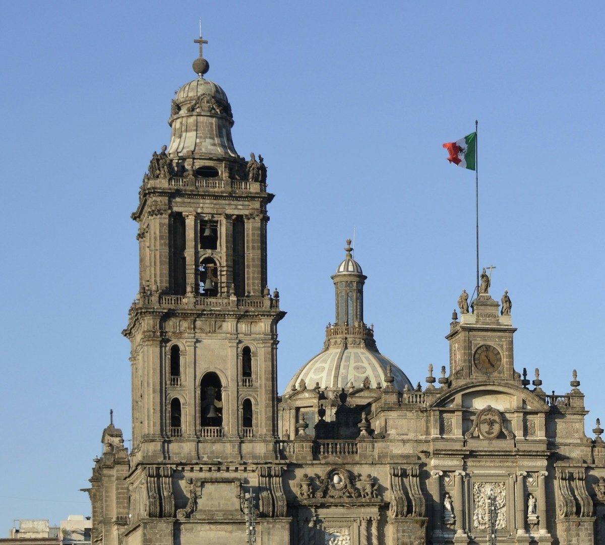 The Metropolitan Cathedral and a Mexican flag in Mexico City's historic centre.